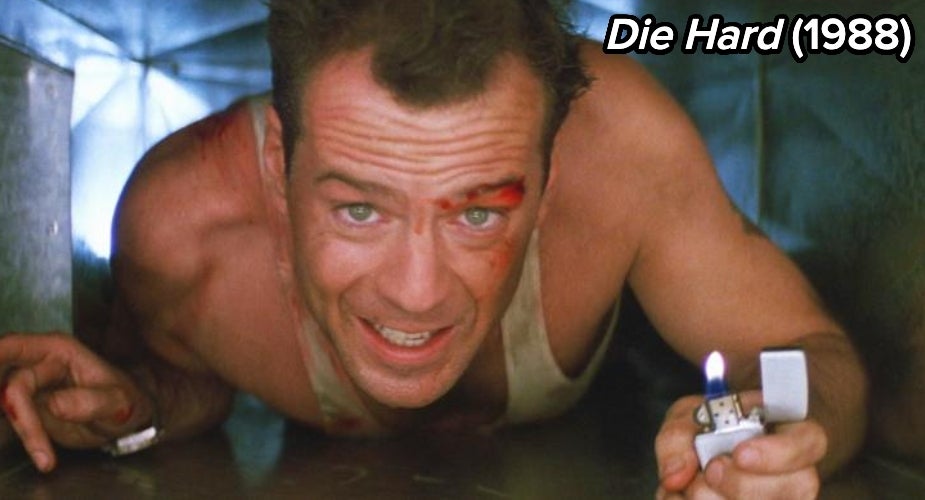 Bruce Willis in Die Hard climbing through ductwork with a lighter in hand