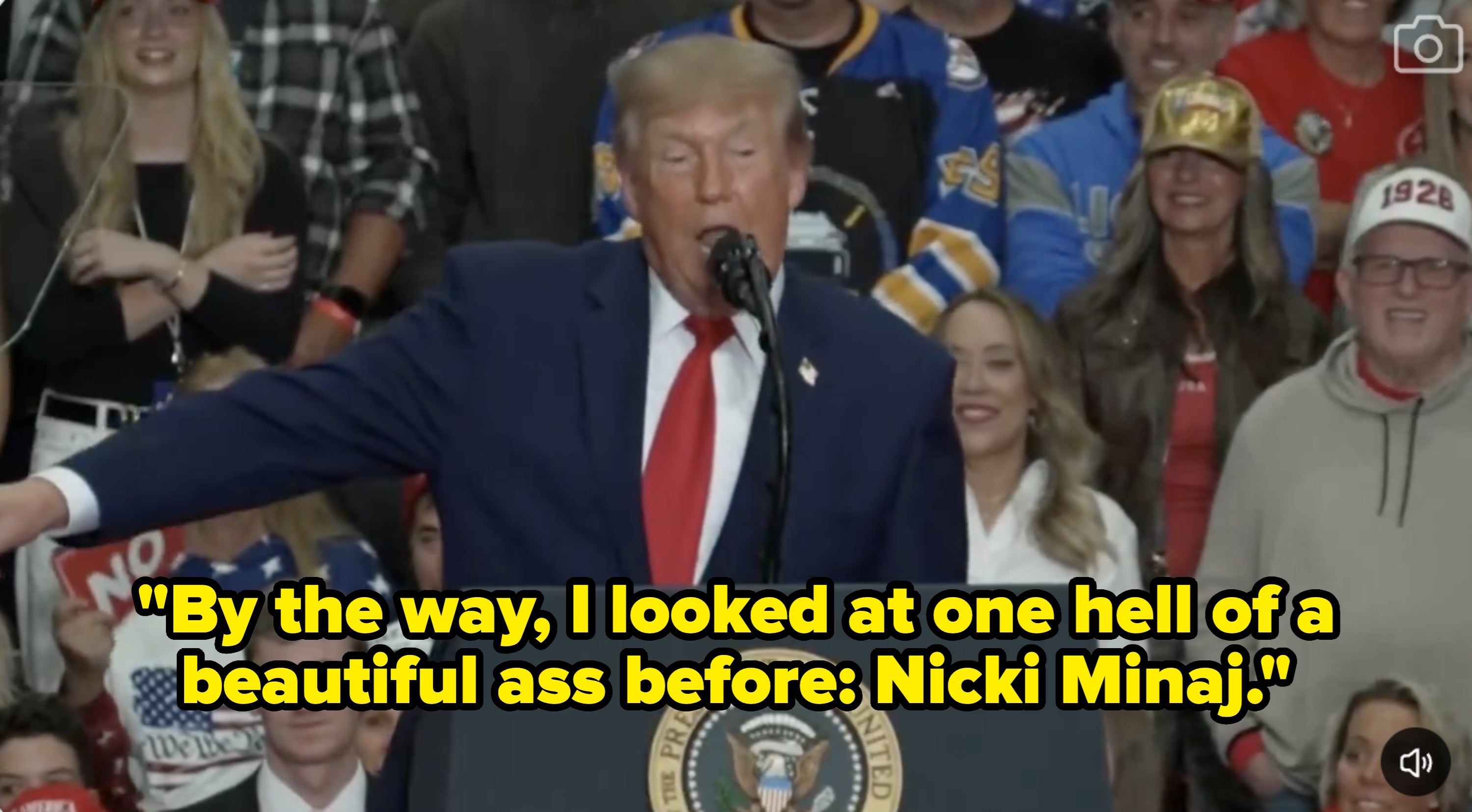 A antheral   speaks astatine  a podium with the statesmanlike  seal, addressing a assemblage  astatine  an indoor event