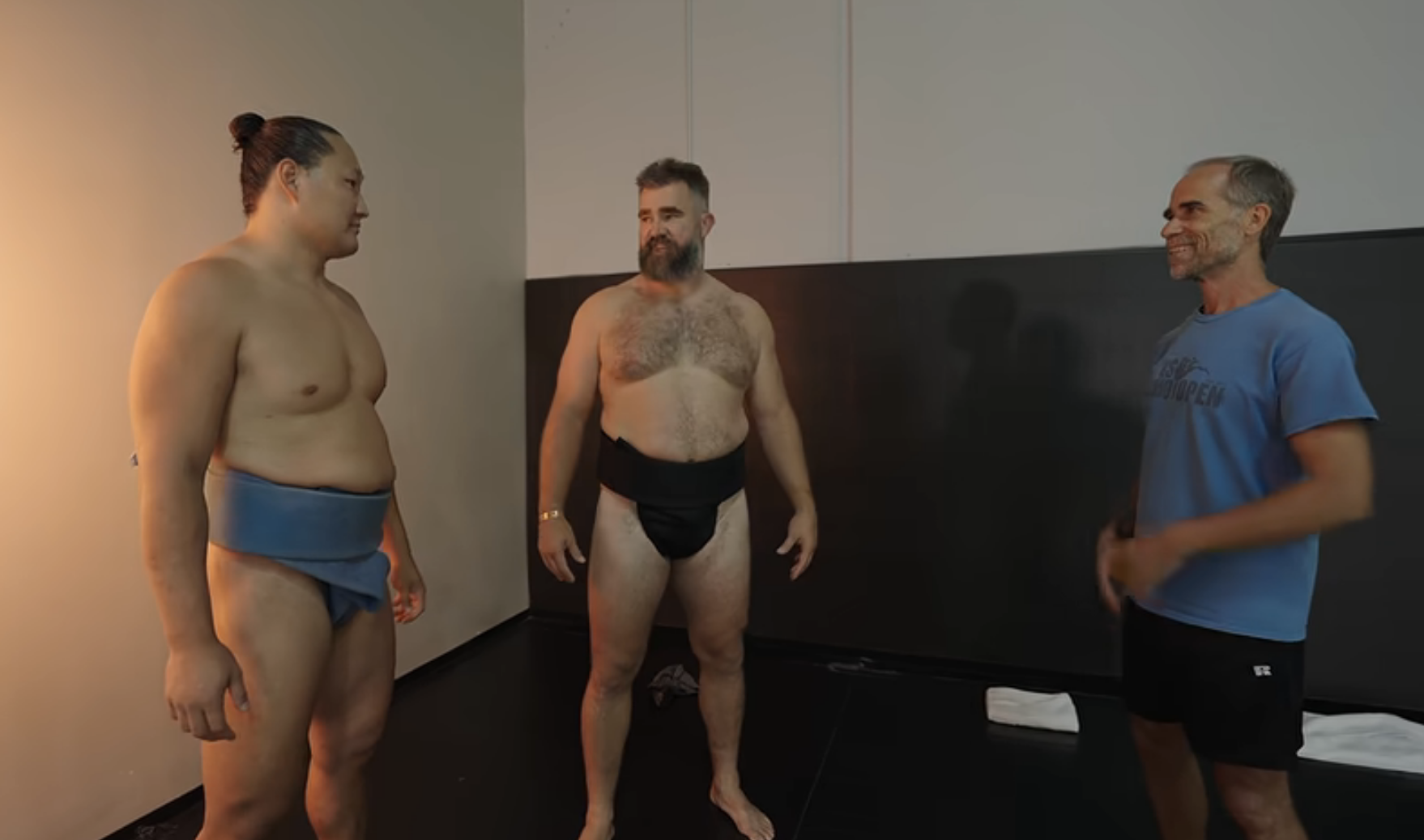 Jason, shirtless, preparing for sumo wrestling