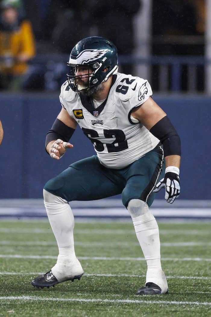 Jason crouching on a field during a football game