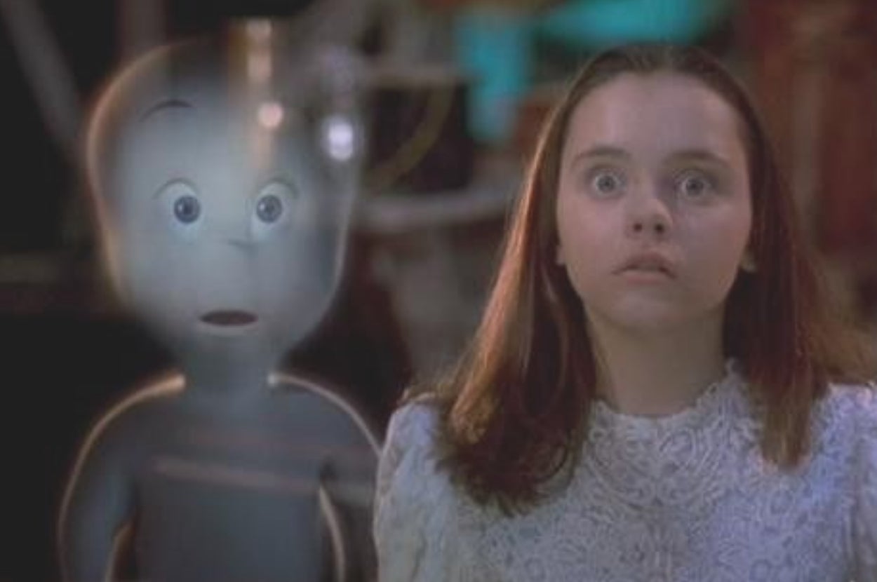 A young girl with wide eyes stands next to a friendly ghost with a surprised expression