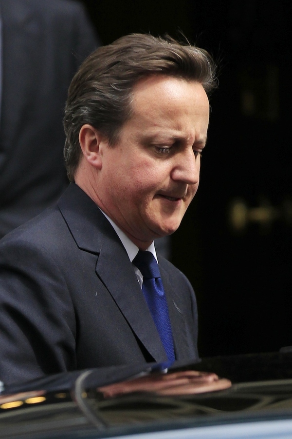 British Prime Minister David Cameron leaves No.10 Downing Street for Prime Minister&#39;s Questio...