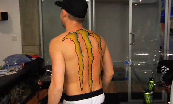 Branding His Entire Back With The Monster Energy Drink Logo