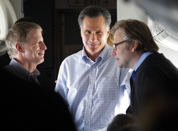 Romney speaks to advisers Stuart Stevens and Eric Fehrnstrom on the flight from Des Moines to Manchester January 4.
