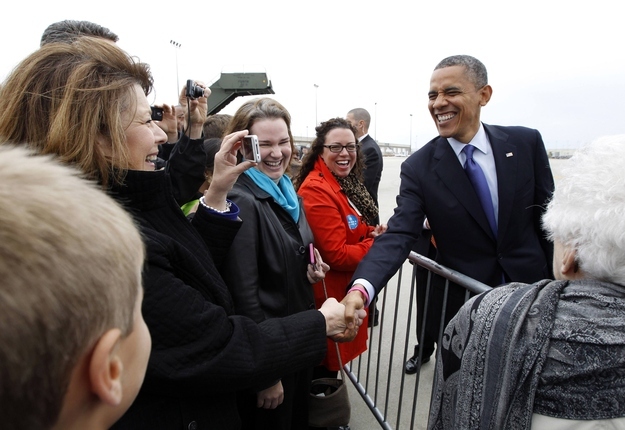 U.S. President Barack Obama meets with a crowd who greeted him upon arrival in Cedar Rapids, Iowa, Wednesday.
