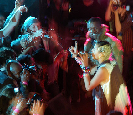 Kanye West raps with Kid Sister at The Museum of Natural History in the planetarium.