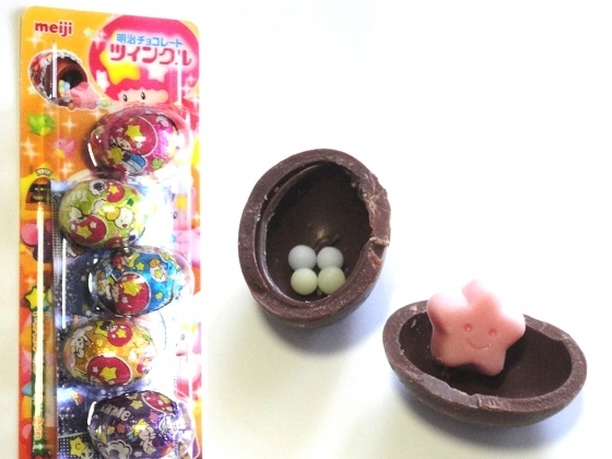 These chocolate balls are the habitat of tiny crunchy balls and a star very happy to meet you.