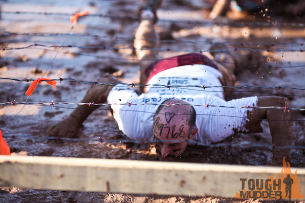 Kiss Of Mud: Crawl underneath a barbed wire only 8 inches off the ground.
