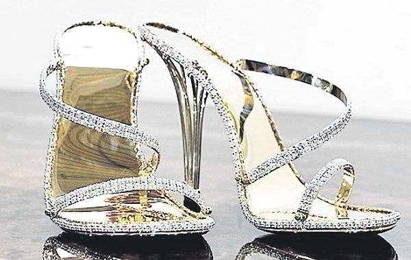 These shoes are solid gold and contain 30 carats of diamonds. They were for sale at the House of Borgezie in the UK for £140,000.