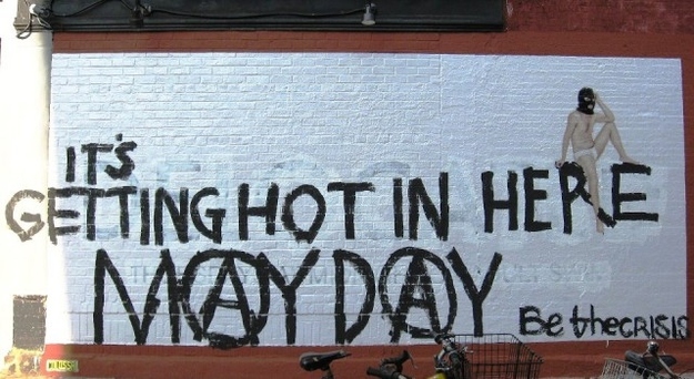 A promotional mural for the Cartoon Network show Delocated in Williamsburg, Brooklyn, got tagged with anarchy symbols and a call to "Be the Crisis." This photo was taken by Urban Infidel, a conservative Williamsburg blogger who tracks the activities of "the local OWS jerks." (Bedford Avenue and N 6th St)