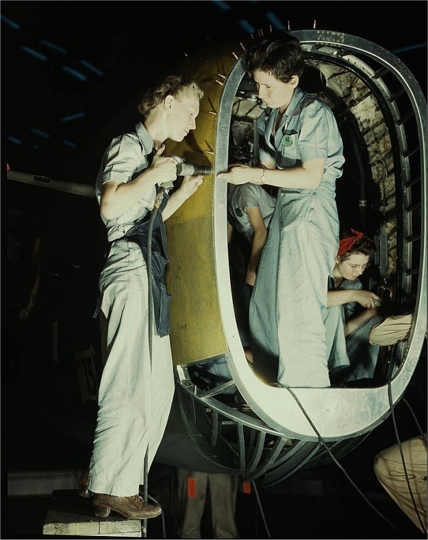 Riveters at work in Fort Worth, Texas. Photographed by Howard R. Hallem in October 1942.
