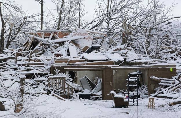 Snow covers a storm-damaged home in Henryville, Indiana, March 5, 2012. Calm weather gave dazed residents of storm-wracked U.S. towns a respite on Sunday as they dug out from a chain of tornadoes that cut a swath of destruction from the Midwest to the Gulf of Mexico, killing at least 39 people.