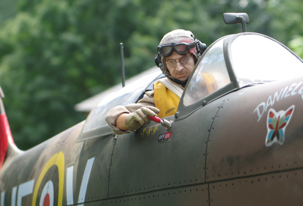 "Scott Merry flicks the ignition switch to start up his repaired Spitfire."