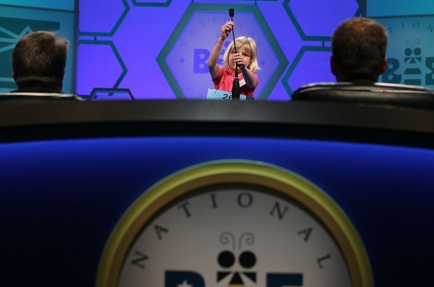 NATIONAL HARBOR, MD - MAY 30: 6-year old Lori Anne C. Madison adjusts the microphonebefore spelling a word correctly during the second round of the 2012 Scripps National Spelling Bee competition May 30, 2012 in National Harbor, Maryland. 278 spellers are competing in the 85th annual competition.
