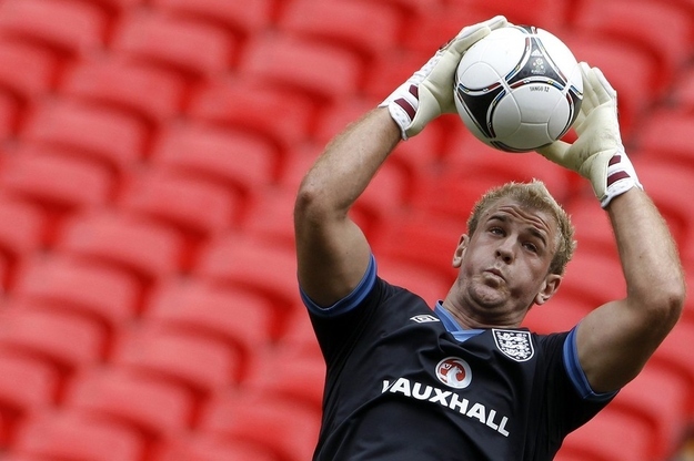 England's goalkeeper Joe Hart catches a ball during a team training session at Wembley Stadium in London.