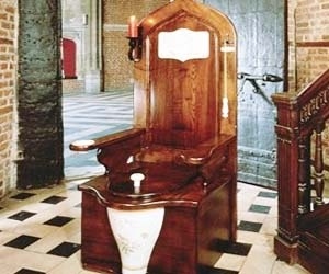 Reign supreme on the porcelain throne with this beautifully crafted royal toilet that is fit for a king. With medieval luxury, this wooden royal toilet throne includes a candle holder, ash tray, and even plays a musical chime as the toilet seat gloriously rises.
