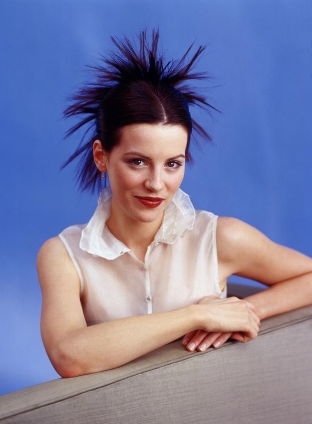 Photographer: "The hair, it's like a bun. But instead of wrapping it completely, let's spread it all around your head so it looks like there's a giant spider about to consume her it!"