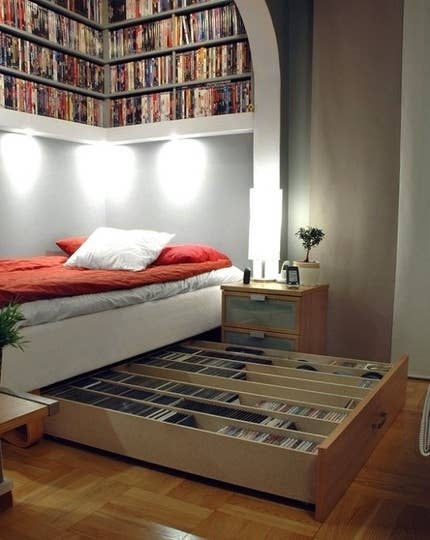 This is a bed with a large media drawer created by IKEA Lack shelves.