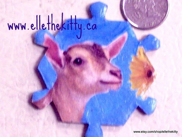 goat from an ad. handpainted background brooch