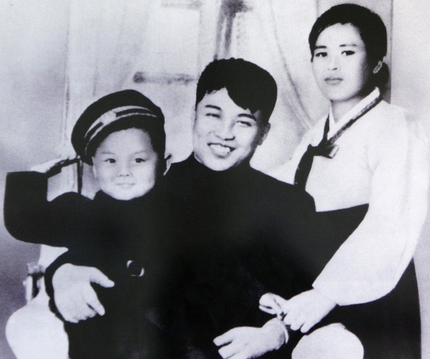 Kim Jong-Il as a child with his father and mother