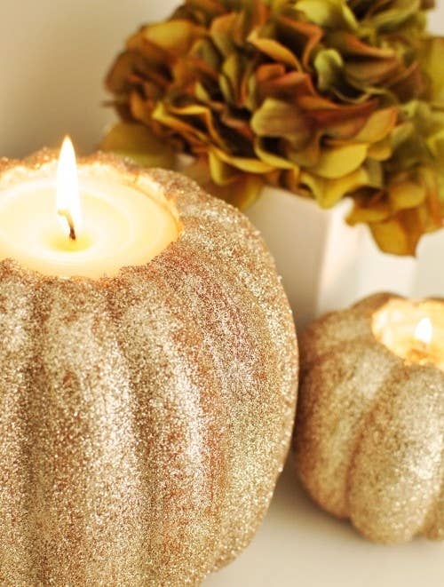 Learn how to make glitter pumpkin candleholders.
