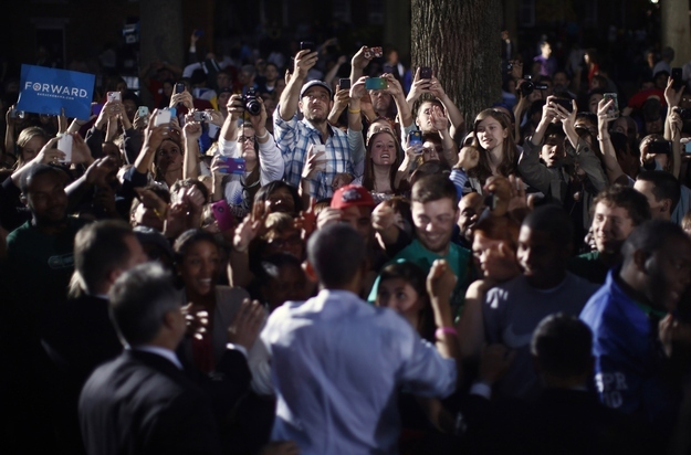 Supporters of U.S. President Barack Obama take photographs with their cameras during his campaign rally at Ohio University in Athens, Ohio, October 17.