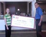 Florida Institute of Technology's Brooke Adams is awarded the 2011 National High Five Day Scholarship check from Melbourne, Florida Mayor Harry Goode.