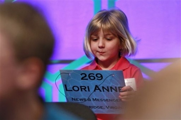 Lori Anne Madison, 6, of Woodbridge, Va., takes her seat as the youngest speller in the National Spelling Bee, before competing in the Bee in Oxon Hill, Md., Wednesday, May 30, 2012.