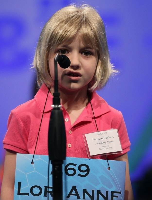 NATIONAL HARBOR, MD - MAY 30: 6-year old Lori Anne C. Madison spells a word correctly during the second round of the 2012 Scripps National Spelling Bee competition May 30, 2012 in National Harbor, Maryland. 278 spellers are competing in the 85th annual competition.