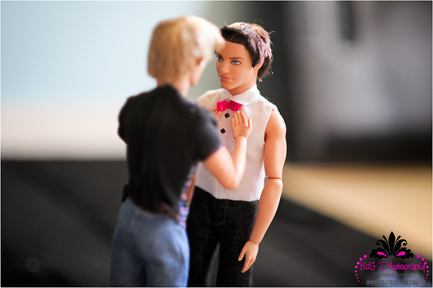 Ken's best man straightens his bow tie. His hot pink bow tie.