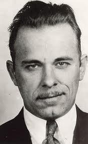 Bank-robbing, jail-escaping, smirking badass.
