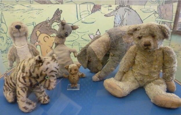 A. A. Milne had a son named Christopher Robin, who in turn had a menagerie of stuffed toys that lent their names to the animals that lived in the Hundred Acre Woods. How did Winnie get his name? Christopher Robin's famous teddy bear was named after a black bear that lived at the London Zoo. The stuffed toys that inspired the Pooh novels are on display at New York Public Library.