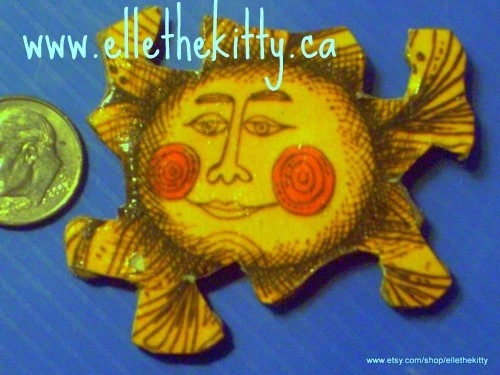 sun pendant made from a recycled childrens book