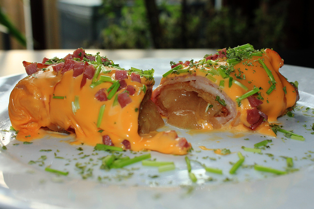 Bacon covered deep-fried "McDonald's apple turnover" topped with cheese, bacon bits and fresh herbs.