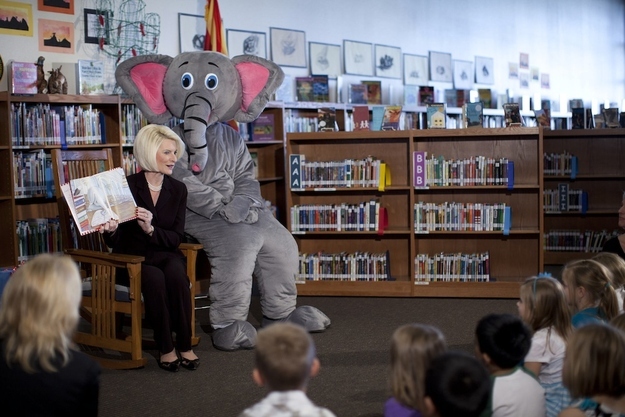 Callista Gingrich, wife of Republican presidential candidate, former House Speaker Newt Gingrich, reads to children at Chaparral Elementary School as Ellis the Elephant, a character from her book, watches Wednesday, Feb. 22, 2012, in Gilbert, Ariz.