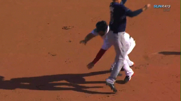 Which, for some mysterious reason, he decides will be throwing himself at the base head first; not sliding, mind you, but flopping down like a tranquilized bear.