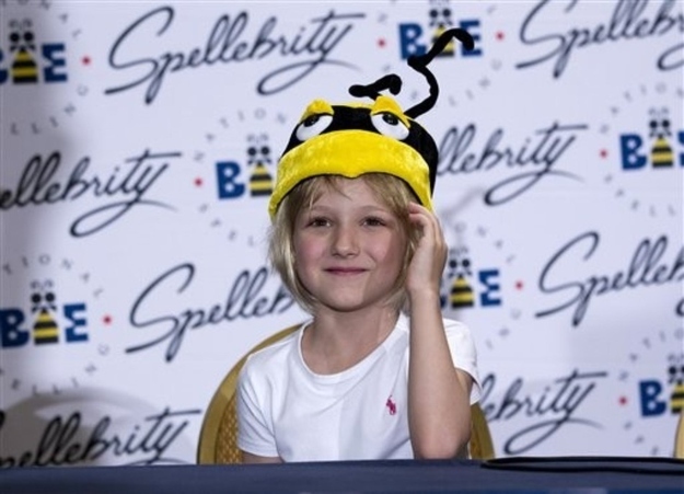 Six-year-old Lori Anne Madison, of Woodbridge, Va., the youngest contestant in the history of the National Spelling Bee, speaks during a news conference, Thursday, May 31, 2012, in Oxon Hill, Md.