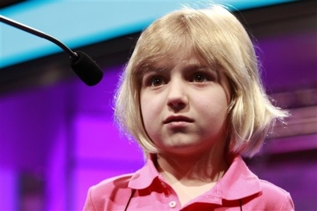 Lori Anne Madison, 6, of Woodbridge, Va., the youngest speller ever to compete in the National Spelling Bee, reacts after misspelling her word, ingluvies, in the third round of the bee in Oxon Hill, Md., on Wednesday, May 30, 2012. She will not be moving on to the semifinals.