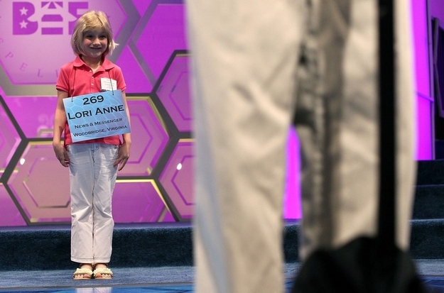 NATIONAL HARBOR, MD- MAY 30: Six-year-old Lori Anne Madison waits her turn to spell during the third round of the 2012 Scripps National Spelling Bee competition May 30, 2012 in National Harbor, Maryland. Lori who is the youngest speller to participate failed to make it to the finals of the annual competition. 278 spellers are competing in the 85th annual competition.