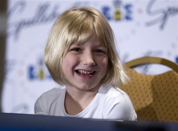 Six-year-old Lori Anne Madison of Woodbridge, Va., the youngest contestant in the history of the National Spelling Bee, speaks during a news conference, Thursday, May 31, 2012, in Oxon Hill, Md.