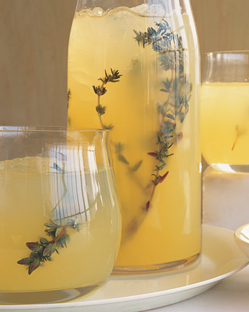 Martha Stewart has a version of this recipe, but she makes a thyme-infused simple syrup, and I prefer to infuse the vodka. Both ways require a little preparation, so this isn't exactly a spur of the moment cocktail. To make thyme infused vodka, take three cups of vodka, and add half a cup of fresh thyme. Put them in a jar and shake it up. I like to listen to "Shake It Up" by The Cars at this point, but that is not required. Put the jar in a cabinet (or somewhere else cool and dark) for three or four days. Be sure to visit it a couple of times a day to give it a good shake. When it's ready, just strain it through a coffee filter to get out all the icky bits and there you have it. Now get out your pitcher and fill it halfway with ice. Add some lemon slices and a few sprigs of thyme in whatever artistic fashion you'd like and then fill the rest of the pitcher with ice. Add 1 cup of your distilled vodka and two cups of lemonade. If that isn't enough to fill the pitcher, continue with the 1:2 ratio until it's full. Preferably serve this one in a tall glass, so you can put a sprig of thyme in for garnish along with a lemon slice.