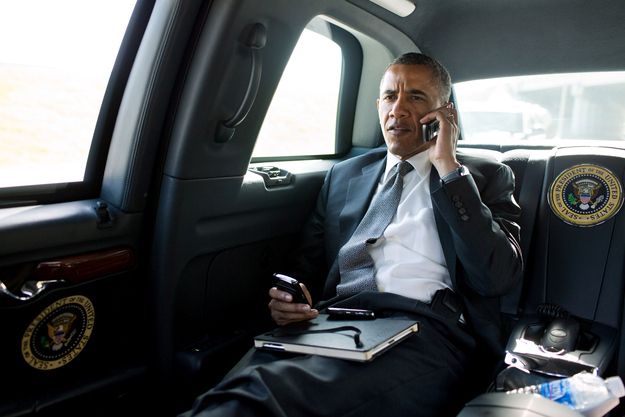 President Barack Obama talks on the phone with Aurora Mayor Steve Hogan during the motorcade ride to Palm Beach International Airport in Palm Beach, Fla., July 20, 2012. The President called Mayor Hogan to offer his condolences and support to the Aurora community. (Official White House Photo by Pete Souza)