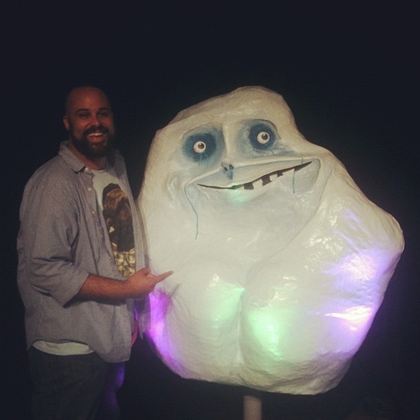 Behind the speakers' panel was this giant Forever Alone head, seen here with Funny Or Die's Darryl Gudmundson.
