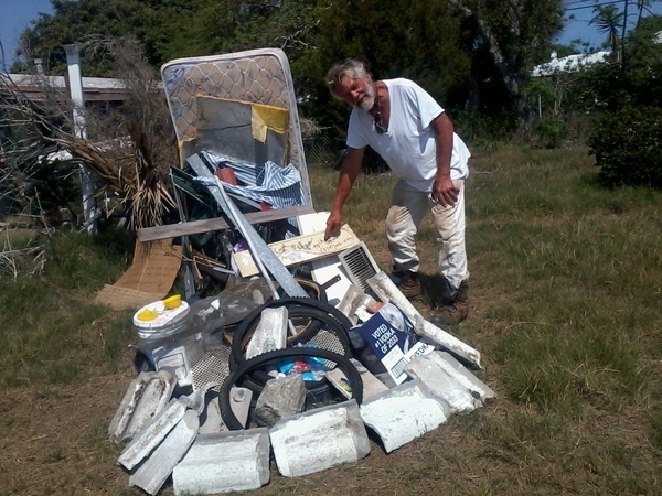 Matress, Tires, Wood, and Blocks on Lawn