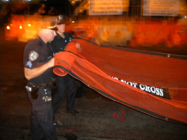 As soon as the police noticed the dozens of cameras taking photos of the nets, they began rolling them up.