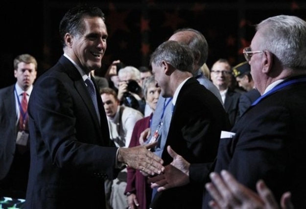 Republican presidential candidate former Governor Mitt Romney, left, greets the crowd after delivering his remarks at the Values Voter Summit in Washington, Saturday, Oct. 8, 2011. For the cultural conservatives at the summit, who care deeply about abortion, gay marriage and other social issues, pocketbook issues seem to matter more this year than pulpit preaching, and at least some are willing to embrace Romney, who many have long looked at skeptically for his reversals on some of their priorities and his Mormon faith.