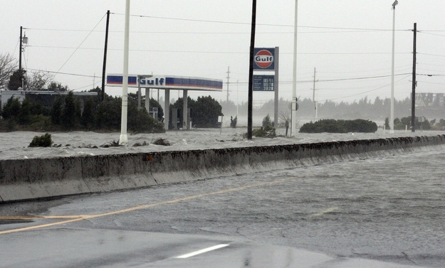 A gas station along U.S. Route 30, the White Horse Pike, one of three major approaches to Atlantic City, New Jersey, is submerged in water.