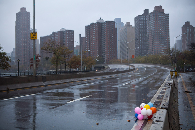 Balloons lie on the side of the closed FDR Drive as Hurricane Sandy moves closer to the area on October 29, 2012 in New York.