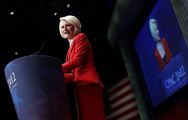 WASHINGTON, DC - FEBRUARY 10: Callista Gingrich introduces her husband at CPAC, donning a red skirt suit that her friends at Neiman Marcus say is typical of her style.