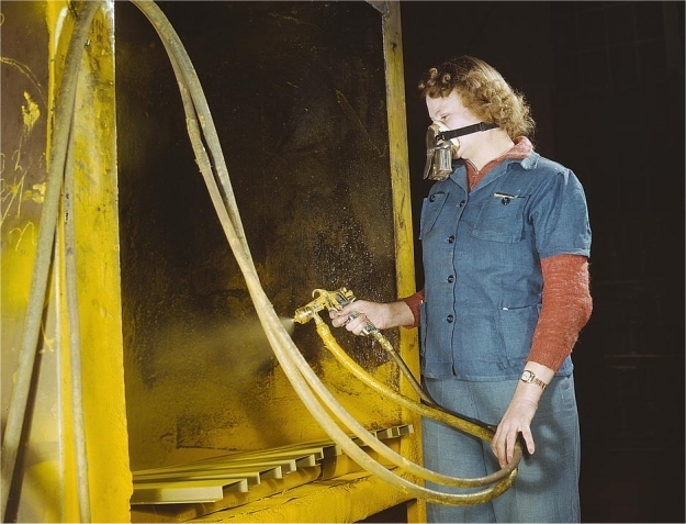 Elizabeth Little at work spraying parts. Photographed by Howard R. Hallem in February 1943.